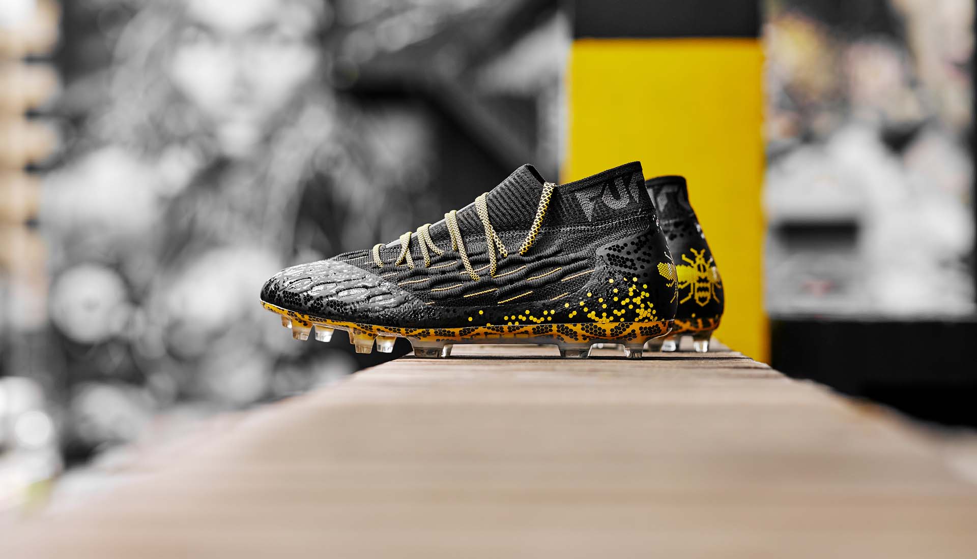 black and yellow puma football boots