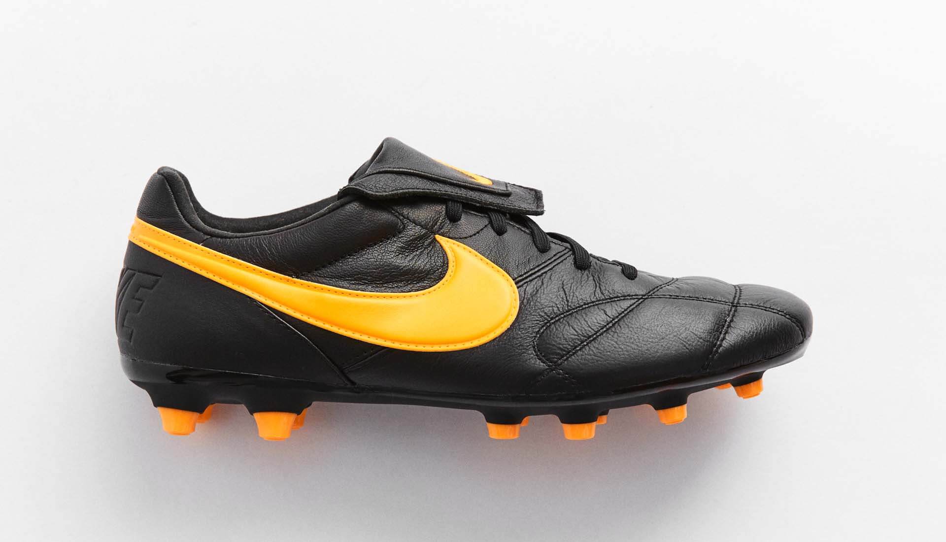 nike black and orange football boots