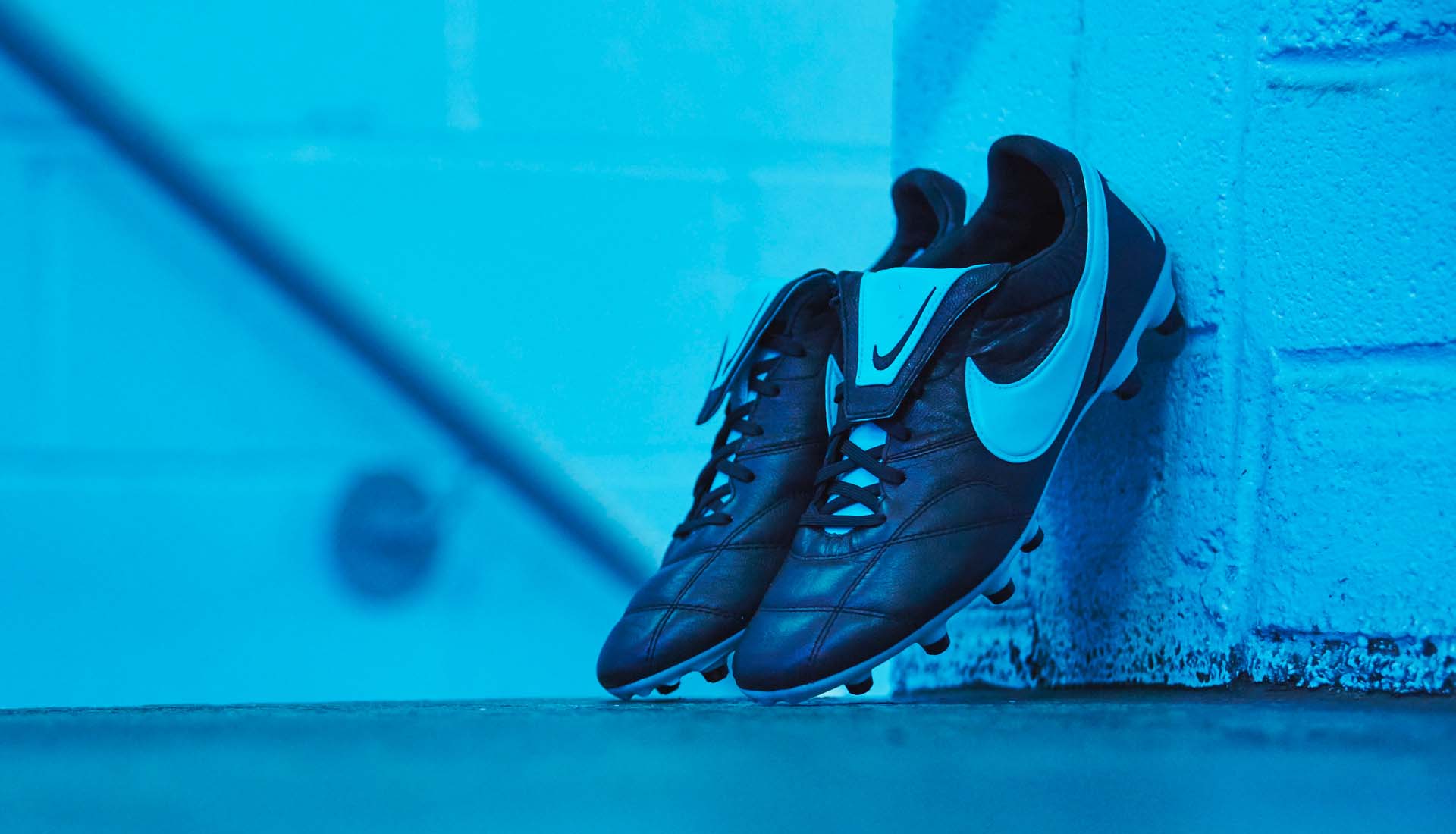 black and blue football boots