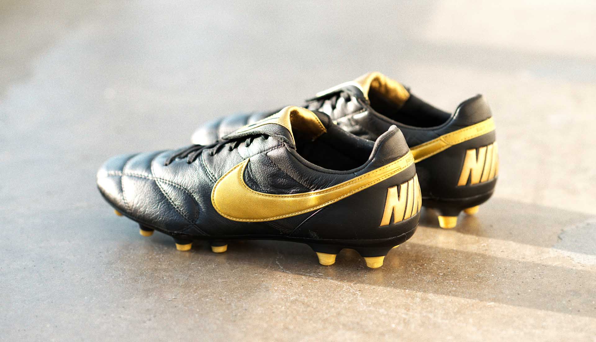 black and gold nike football boots